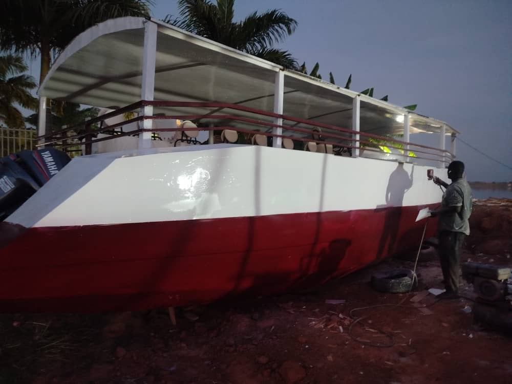 Flotilla Academy vessel construction — skilled craftsmen building custom boats